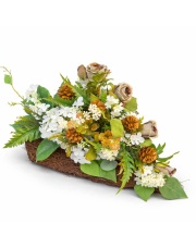 Wiosenna kompozycja nagrobna na Wielkanoc ze sztucznych kwiatów